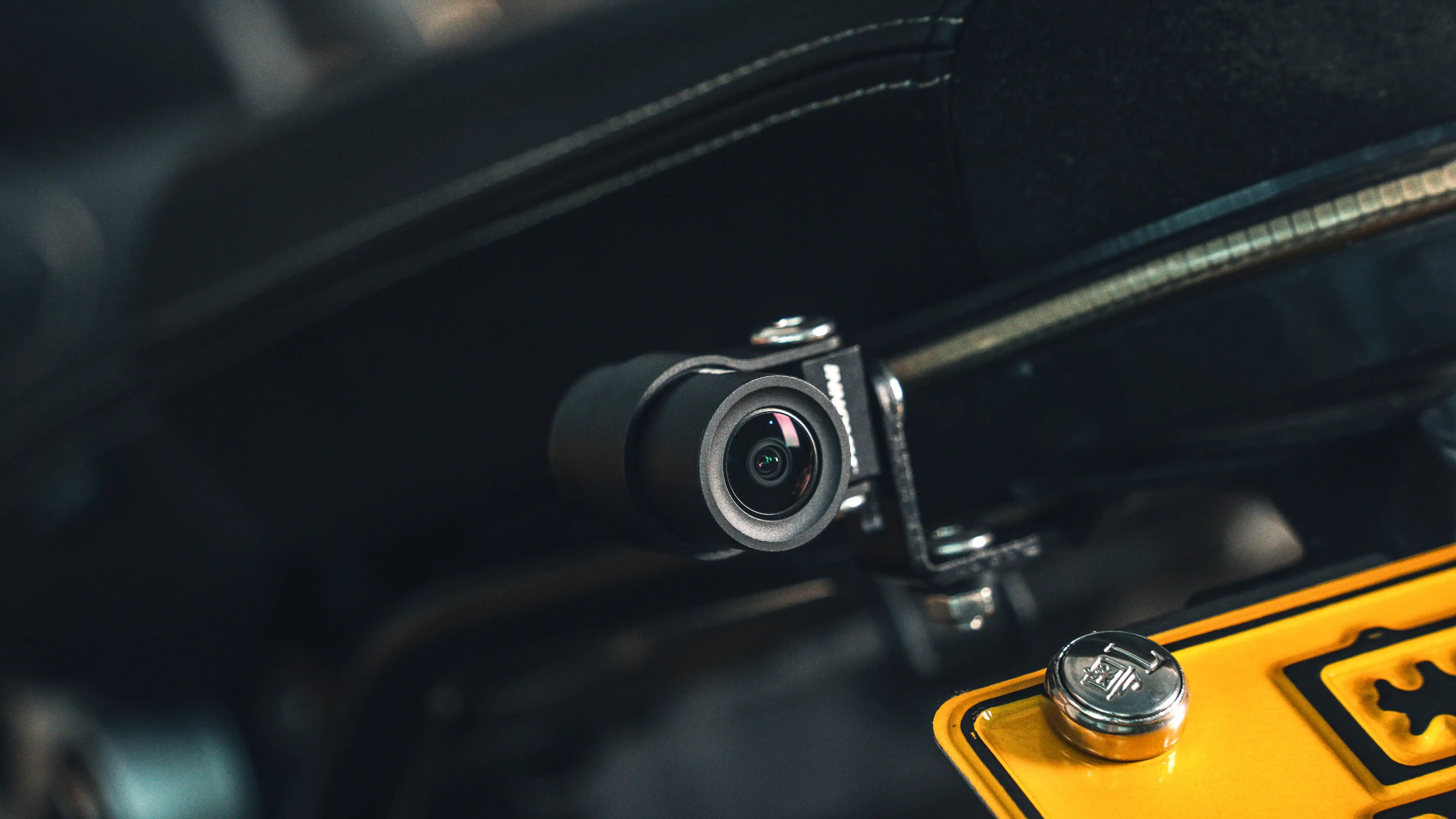 Discrete motorcycle rear camera mounted near the license plate for rear-view dashcam protection